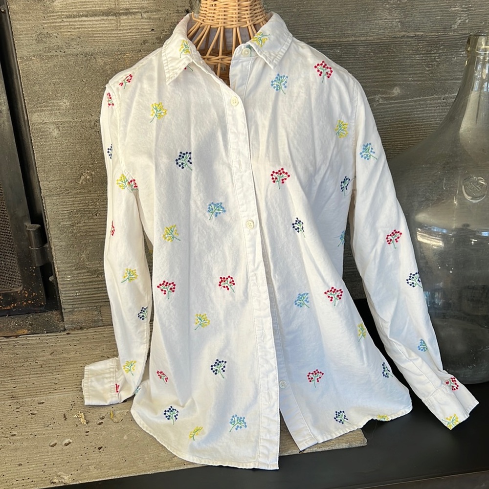 The Great white button down shirt with embroidered flowers.